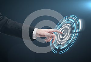 Hand pushing a button on a touch screen interface.