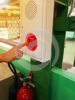 Hand Is pushing Fire Alarm Switch