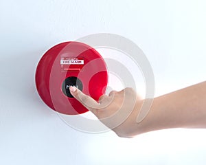 Hand is pushing fire alarm switch