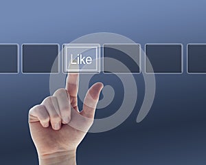 Hand pushing the like button