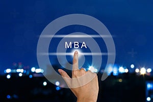 hand pushing The Master of Business Administration (MBA or M.B.A.) button on touch screen