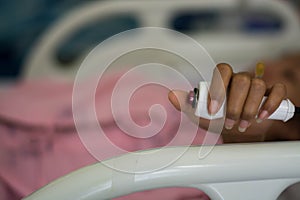 Hand pushing nurse call button