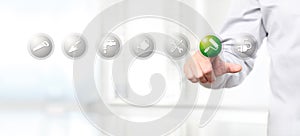 hand pushing on a touch screen interface paint roller symbol icon, web banner