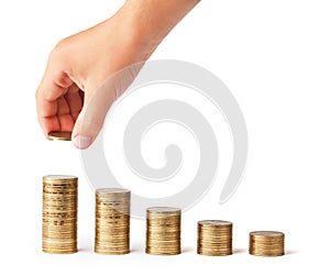 Hand put coin to money stack