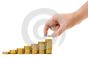 Hand put coin to money staircase