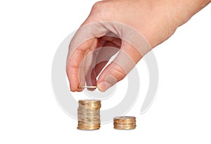 Hand put coins to stack of coins