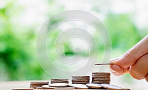 Hand put money coins to stack of coins. Money, Financial,