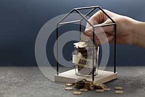 Hand puts savings in a piggy bank. Save money in bank, financial savings from citizens. Investment and deposit enrichment
