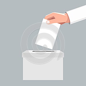 Hand puts vote bulletin into vote box. photo