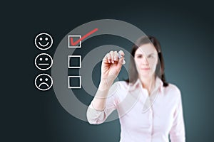 Hand putting check mark with red marker on customer service evaluation form. Blue background.