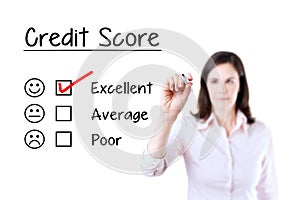 Hand putting check mark with red marker on excellent credit score evaluation form. Isolated on white.