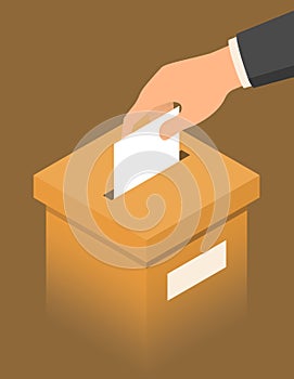 Hand putting paper in the brown ballot box photo