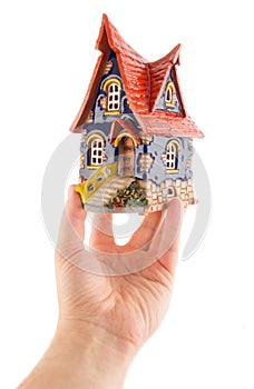 Hand with quaint house