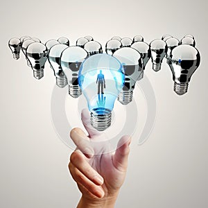 Hand reach 3d light bulb of leadership