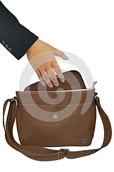 Hand reaching into a brown bag