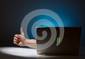 Hand Reaching Out of Computer Giving Thumbs Up