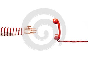 Hand reaching to the red telephone