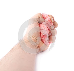 Hand with red bathing sponge isolated over the white background