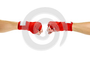 Hand in red Boxing bandages. Fist to fist. Two fists in red Boxing bandages. Sports armband. Isolated on white background