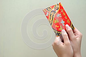 Hand with red packet