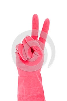 Hand in red rubber glove gesturing victory