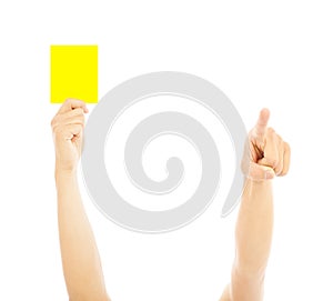 Hand of referee with yellow card to warn photo