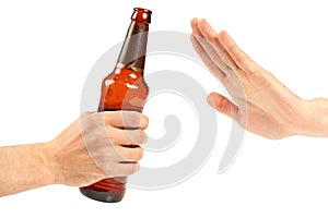 Hand reject a bottle of beer photo