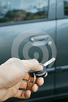 Hand with remote control car key