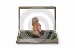 Hand with remote control reaching out of laptop display