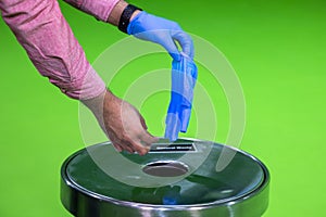 Hand removing rubber gloves in chroma concept sterility purity  photo