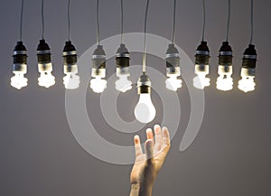 Hand replacing light bulb