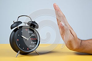 Hand resisting a clock