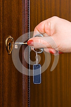 Hand and retro key with label