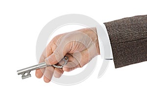 Hand with retro silver key