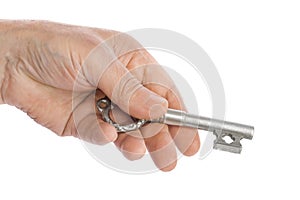 Hand with retro silver key