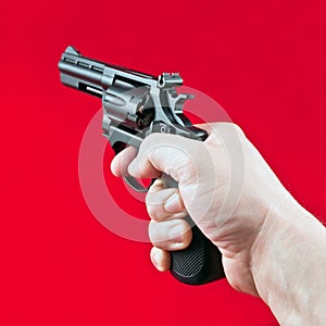 Hand with revolver