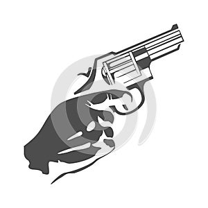 Hand with revolver gun on black background