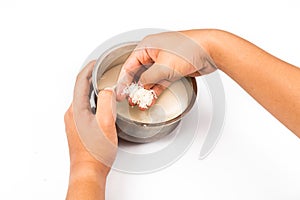 Hand rinses rise with water in a bowl in isolated white. photo