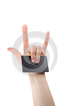 Hand with rock and roll sign holding blank for card, Bank card, isolated on white background, copy space