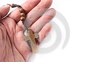 Hand with rosary catholic cross photo