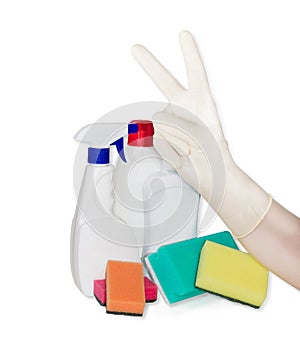 Hand in rubber glove, cleaning sponges and cleaning agents