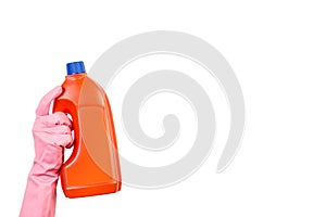 Hand with rubber glove holding cleaning product bottle