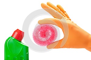 Hand in rubber glove with scrub pad and bottles