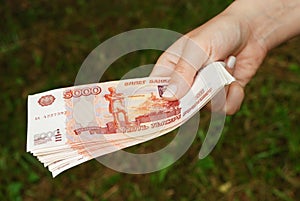 Hand with russian money