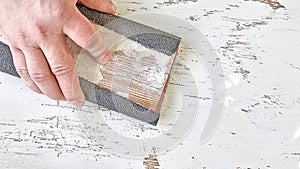 Hand sanding wood, top view.