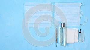 Hand sanitizer bottles, medical masks, pills, antiseptics. Coronavirus protection concept, Covid 19. Hygiene, protection against