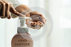Hand sanitizer foam, hand cleansing concept, senior hand apply alcohol gel or anti bacteria soap to make cleaning and clear virus