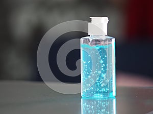 Hand Sanitizer, gel alcoholic mixture with gelatin in clear Plastic bottle with pump pushing wash clean dirty to prevent germs