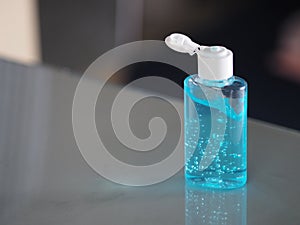 Hand Sanitizer, gel alcoholic mixture with gelatin in clear Plastic bottle with pump pushing wash clean dirty to prevent germs