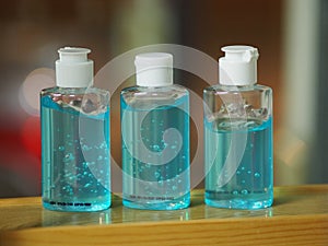 Hand Sanitizer, gel alcoholic mixture with gelatin in clear Plastic bottle with pump pushing wash clean dirty to prevent germs